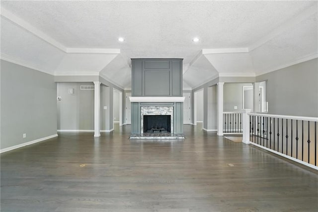 11203 Cedar St, Leawood, KS 66211 - unfurnished living room featuring a textured ceiling, wood finished floors, a high end fireplace, baseboards, and ornate columns