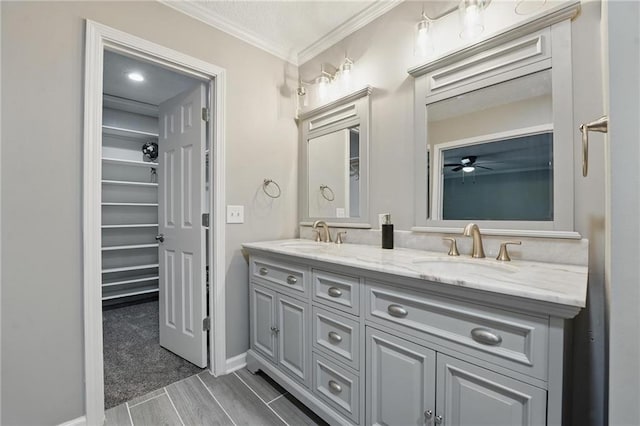 11203 Cedar St, Leawood, KS 66211 - full bathroom with double vanity, crown molding, and baseboards