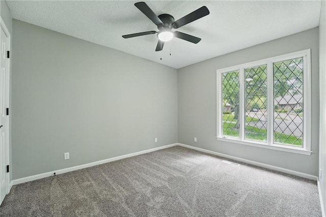 11203 Cedar St, Leawood, KS 66211 - spare room featuring carpet floors, baseboards, a ceiling fan, and a textured ceiling