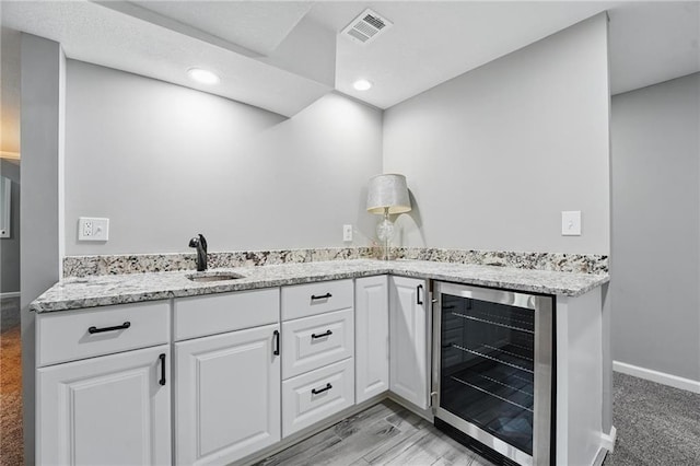 11203 Cedar St, Leawood, KS 66211 - bathroom featuring beverage cooler, recessed lighting, baseboards, and double vanity