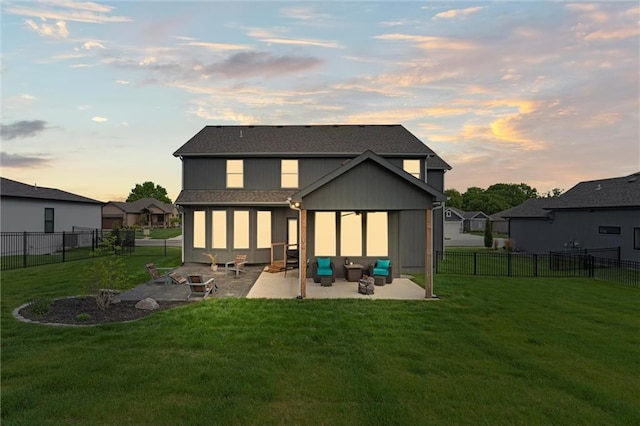 4813 NE Jamestown Dr, Lees Summit, MO 64064 - back of property at dusk featuring a patio area and a fenced backyard