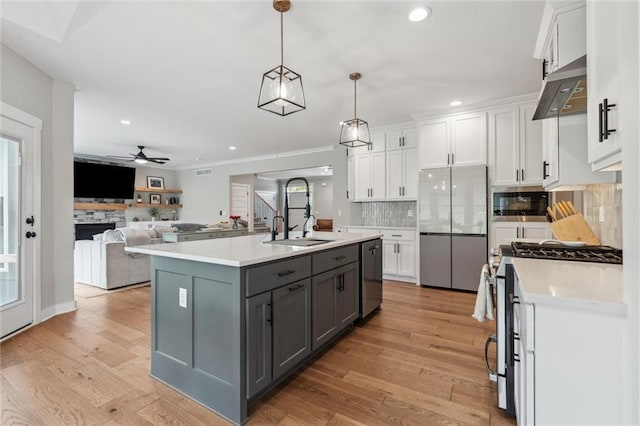 4813 NE Jamestown Dr, Lees Summit, MO 64064 - kitchen with stainless steel appliances, white cabinets, gray cabinets, ceiling fan, and decorative backsplash