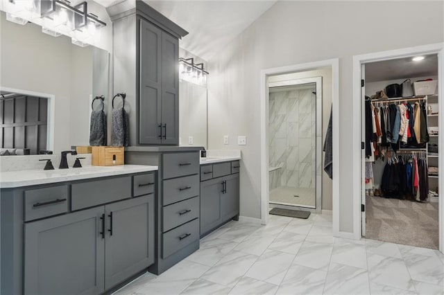 4813 NE Jamestown Dr, Lees Summit, MO 64064 - bathroom featuring double vanity, a stall shower, a spacious closet, marble look tiles, and high vaulted ceiling