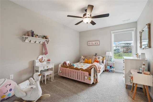 4813 NE Jamestown Dr, Lees Summit, MO 64064 - carpeted bedroom with baseboards and a ceiling fan