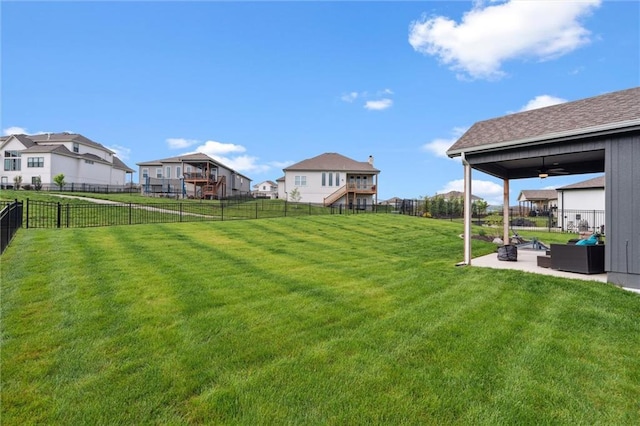 4813 NE Jamestown Dr, Lees Summit, MO 64064 - fenced backyard featuring a patio, a ceiling fan, and a residential view