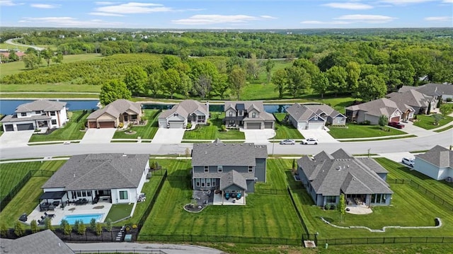 4813 NE Jamestown Dr, Lees Summit, MO 64064 - aerial perspective of suburban area featuring a heavily wooded area and a nearby body of water