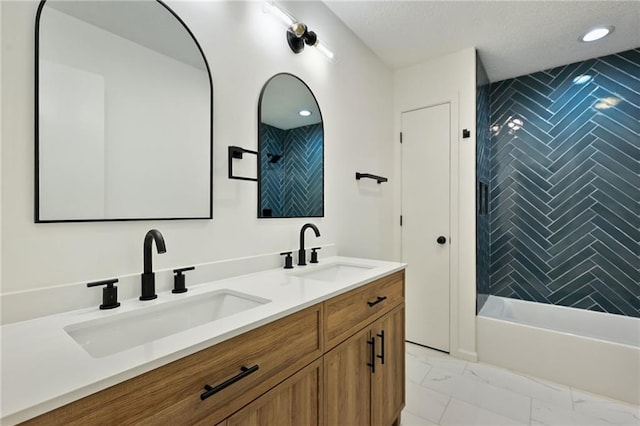 7826 Haskell Dr, Kansas City, KS 66109 - bathroom with marble finish floors, double vanity, bathing tub / shower combination, recessed lighting, and a textured ceiling