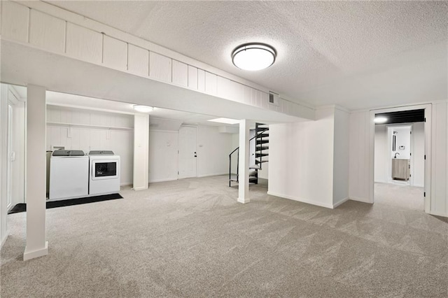 7826 Haskell Dr, Kansas City, KS 66109 - finished below grade area with carpet, stairs, baseboards, a textured ceiling, and independent washer and dryer