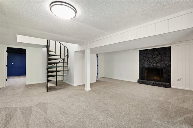 7826 Haskell Dr, Kansas City, KS 66109 - finished basement featuring carpet floors, stairs, a fireplace, a textured ceiling, and baseboards