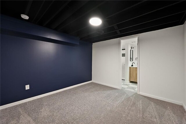 7826 Haskell Dr, Kansas City, KS 66109 - finished below grade area featuring carpet and baseboards