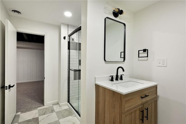 7826 Haskell Dr, Kansas City, KS 66109 - full bathroom featuring marble finish flooring, vanity, a shower stall, and baseboards