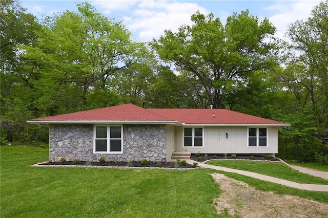 7826 Haskell Dr, Kansas City, KS 66109 - view of front of home with stone siding and a front yard