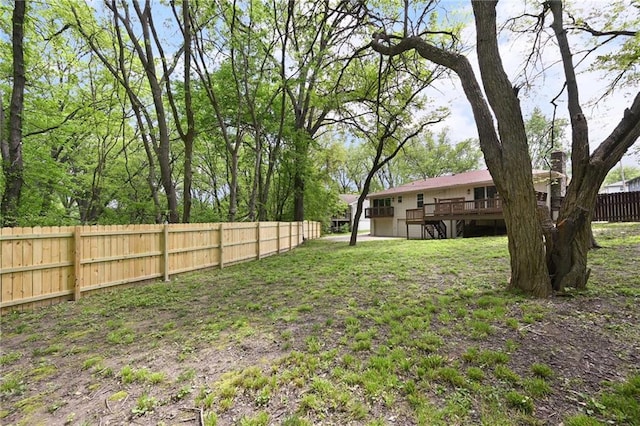 7826 Haskell Dr, Kansas City, KS 66109 - fenced backyard with a wooden deck and stairs
