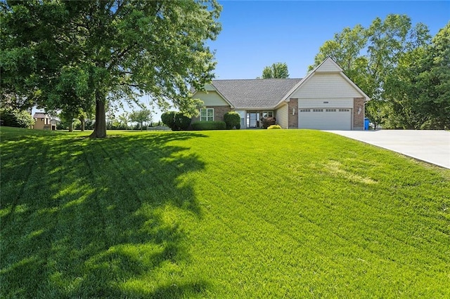 17699 157th Ter, Basehor, KS 66007 - view of front of house with a garage, driveway, a front yard, and brick siding