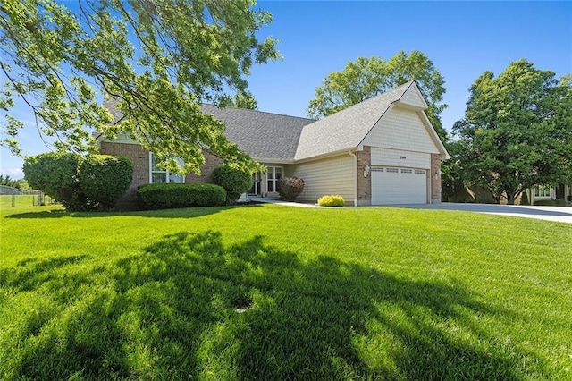 17699 157th Ter, Basehor, KS 66007 - view of front facade with driveway, a front yard, an attached garage, and brick siding