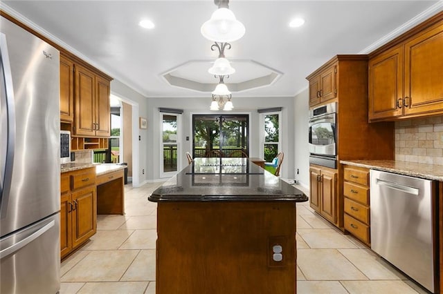 17699 157th Ter, Basehor, KS 66007 - kitchen with stainless steel appliances, a raised ceiling, a center island, backsplash, and recessed lighting