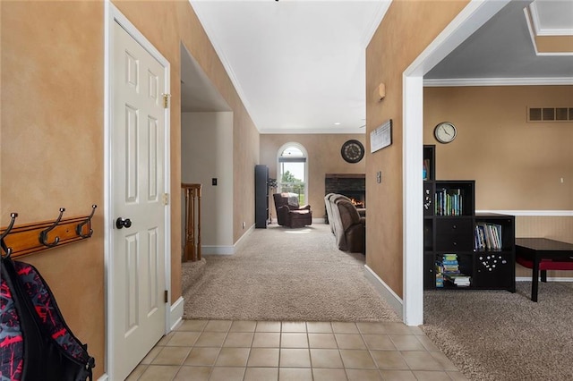 17699 157th Ter, Basehor, KS 66007 - hallway with light colored carpet, crown molding, baseboards, and light tile patterned floors