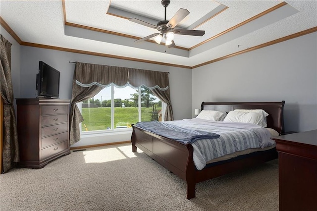 17699 157th Ter, Basehor, KS 66007 - bedroom featuring a raised ceiling, ornamental molding, carpet floors, ceiling fan, and a textured ceiling