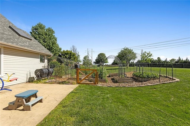 17699 157th Ter, Basehor, KS 66007 - view of yard with a vegetable garden and a patio area