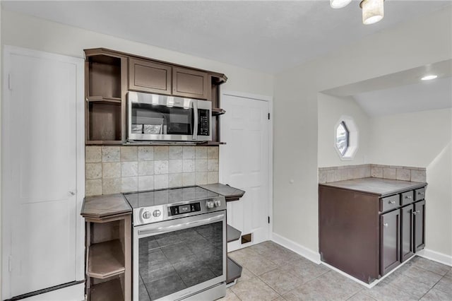 kitchen featuring stainless steel appliances, open shelves, dark brown cabinetry, decorative backsplash, and baseboards