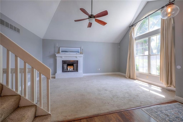 4729 Halsey St, Shawnee, KS 66216 - unfurnished living room with lofted ceiling, ceiling fan, stairs, a brick fireplace, and wood finished floors
