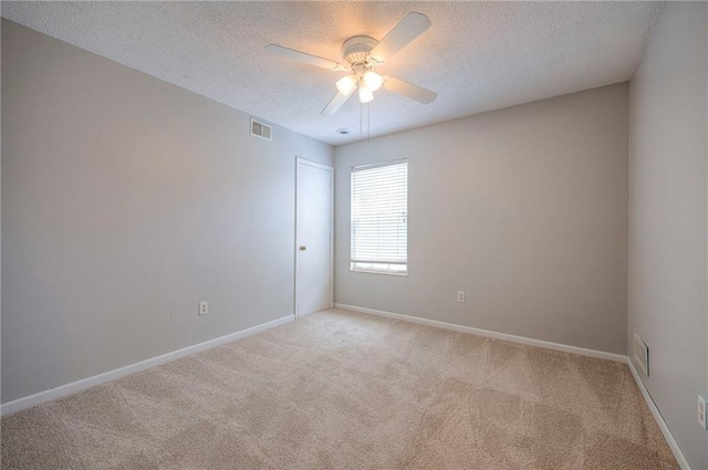 4729 Halsey St, Shawnee, KS 66216 - spare room featuring light carpet, ceiling fan, and a textured ceiling