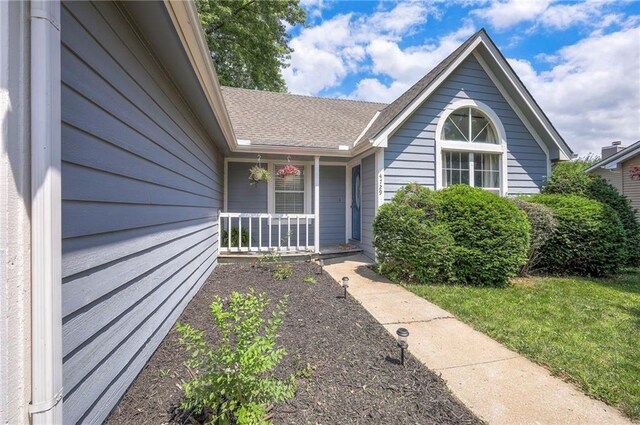 4729 Halsey St, Shawnee, KS 66216 - property entrance featuring covered porch and a shingled roof