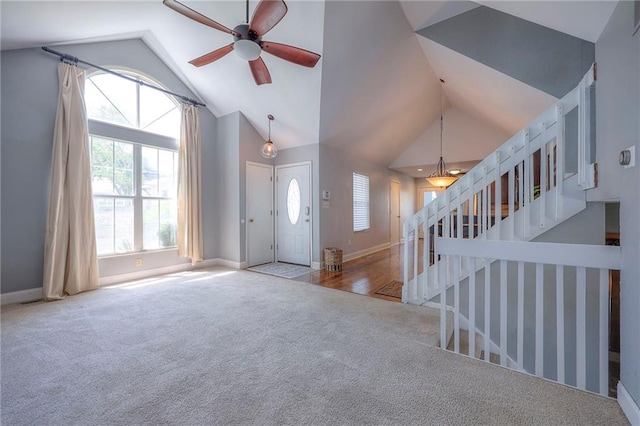 4729 Halsey St, Shawnee, KS 66216 - foyer with carpet, lofted ceiling, a ceiling fan, stairs, and healthy amount of natural light
