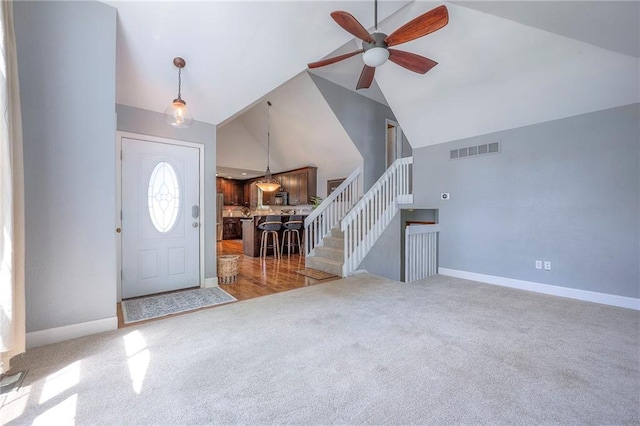 4729 Halsey St, Shawnee, KS 66216 - foyer entrance featuring ceiling fan, carpet, stairs, and high vaulted ceiling