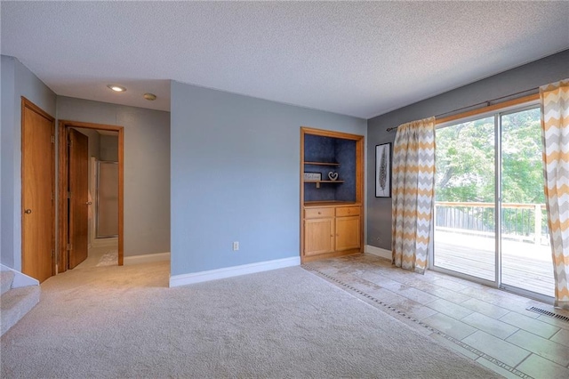 4729 Halsey St, Shawnee, KS 66216 - unfurnished room with a textured ceiling, recessed lighting, and light carpet