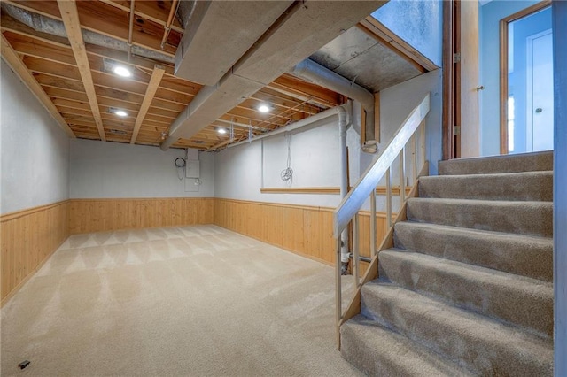 4729 Halsey St, Shawnee, KS 66216 - basement featuring stairway, wainscoting, carpet flooring, and wooden walls
