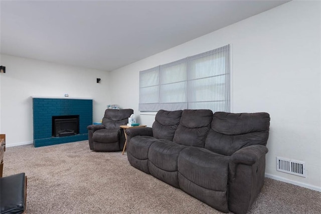 living room featuring carpet floors, a fireplace, and baseboards