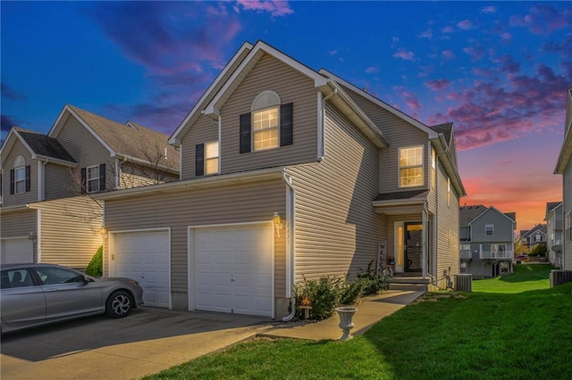8627 NE 97th Ter, Kansas City, MO 64157 - traditional-style home featuring an attached garage, concrete driveway, a front yard, and cooling unit
