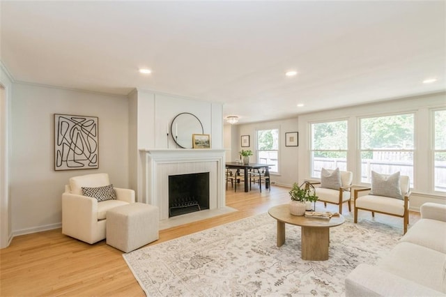 5008 W 79th St, Prairie Village, KS 66208 - living room featuring light wood-type flooring, baseboards, recessed lighting, and a fireplace with flush hearth