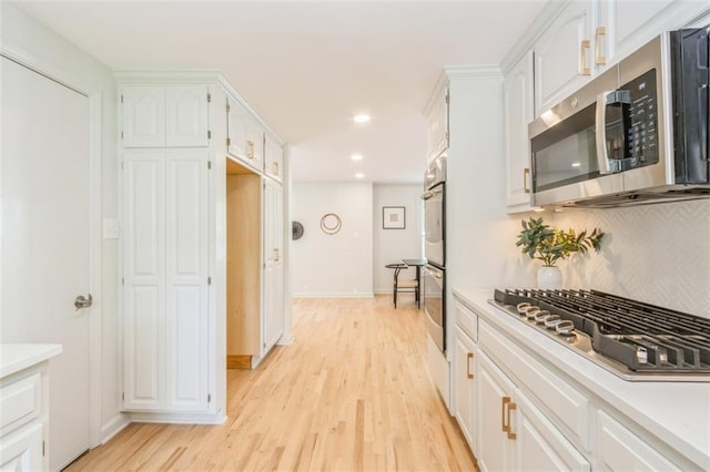 5008 W 79th St, Prairie Village, KS 66208 - kitchen featuring stainless steel appliances, light wood-type flooring, light countertops, and recessed lighting