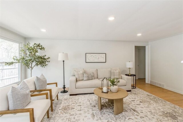 5008 W 79th St, Prairie Village, KS 66208 - living room featuring wood finished floors, recessed lighting, baseboards, and crown molding