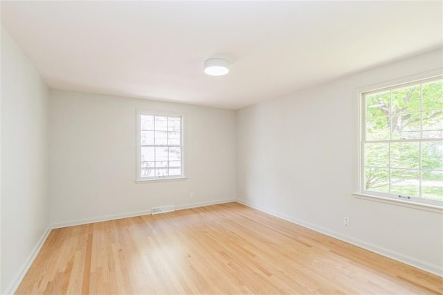 5008 W 79th St, Prairie Village, KS 66208 - unfurnished room with healthy amount of natural light, light wood-style floors, and baseboards
