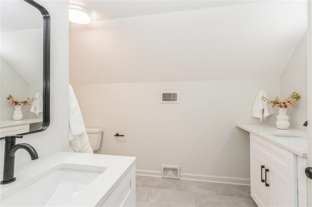 5008 W 79th St, Prairie Village, KS 66208 - bathroom featuring vanity, tile patterned floors, baseboards, and vaulted ceiling