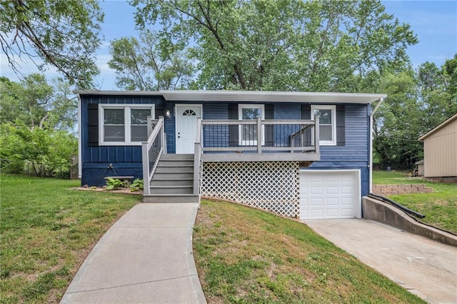 835 N 83rd Dr, Kansas City, KS 66112 - view of front of house featuring a garage, driveway, and a front yard