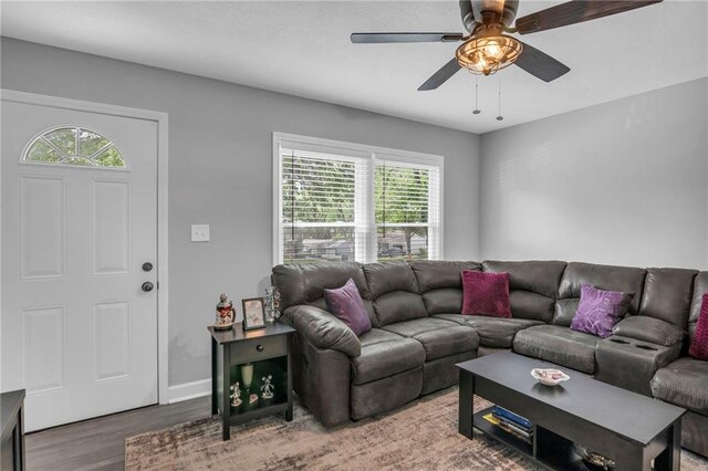 835 N 83rd Dr, Kansas City, KS 66112 - living area with wood finished floors and a ceiling fan