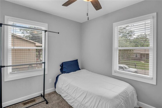 835 N 83rd Dr, Kansas City, KS 66112 - carpeted bedroom featuring baseboards and ceiling fan