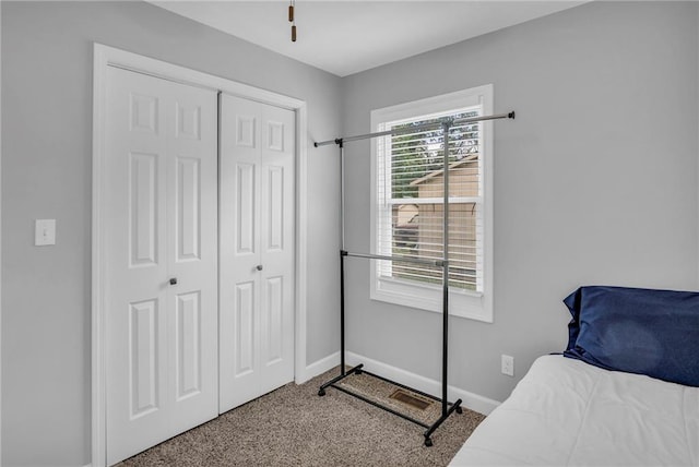 835 N 83rd Dr, Kansas City, KS 66112 - carpeted bedroom featuring baseboards and a closet