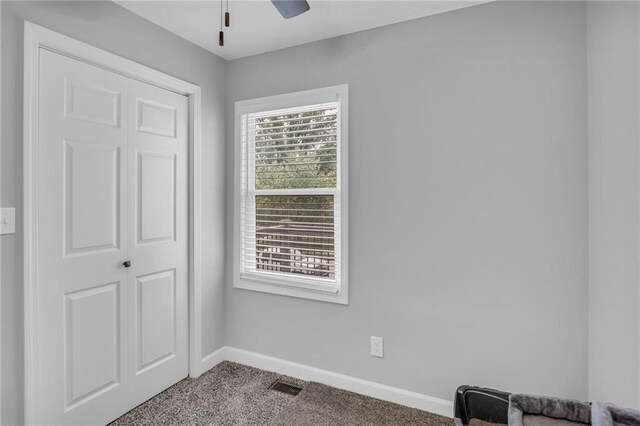 835 N 83rd Dr, Kansas City, KS 66112 - bedroom with carpet, baseboards, and ceiling fan