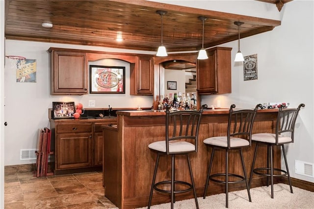 16805 266th Rd, Atchison, KS 66002 - indoor wet bar with wood ceiling, decorative light fixtures, and baseboards