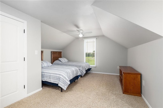 16805 266th Rd, Atchison, KS 66002 - bedroom with light carpet, vaulted ceiling, baseboards, and ceiling fan