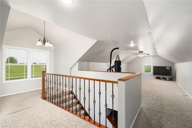16805 266th Rd, Atchison, KS 66002 - hall featuring vaulted ceiling, carpet flooring, an upstairs landing, and baseboards