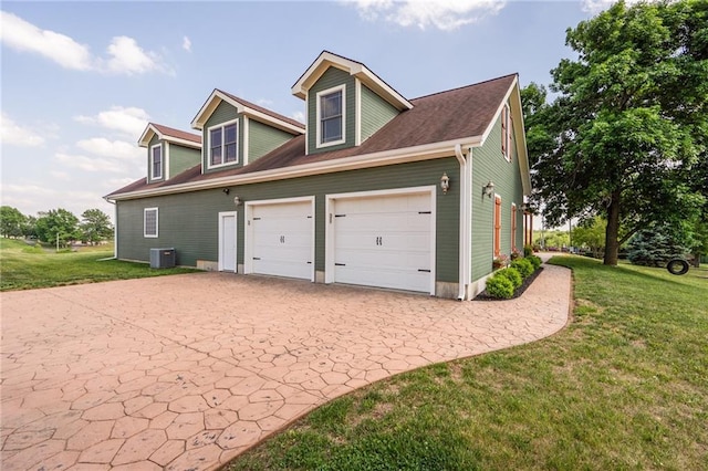 16805 266th Rd, Atchison, KS 66002 - view of side of property with decorative driveway, central AC, and a lawn