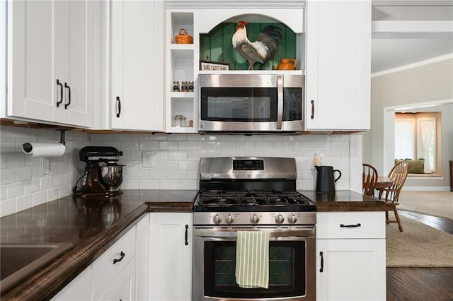 16805 266th Rd, Atchison, KS 66002 - kitchen featuring stainless steel appliances, white cabinets, crown molding, tasteful backsplash, and a sink
