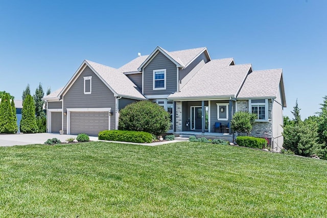 17530 254th St, Tonganoxie, KS 66086 - traditional-style house featuring covered porch, a front yard, stone siding, and concrete driveway