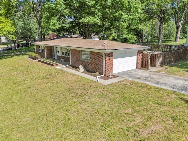 ranch-style home featuring brick siding, asphalt driveway, a porch, an attached garage, and view of wooded area
